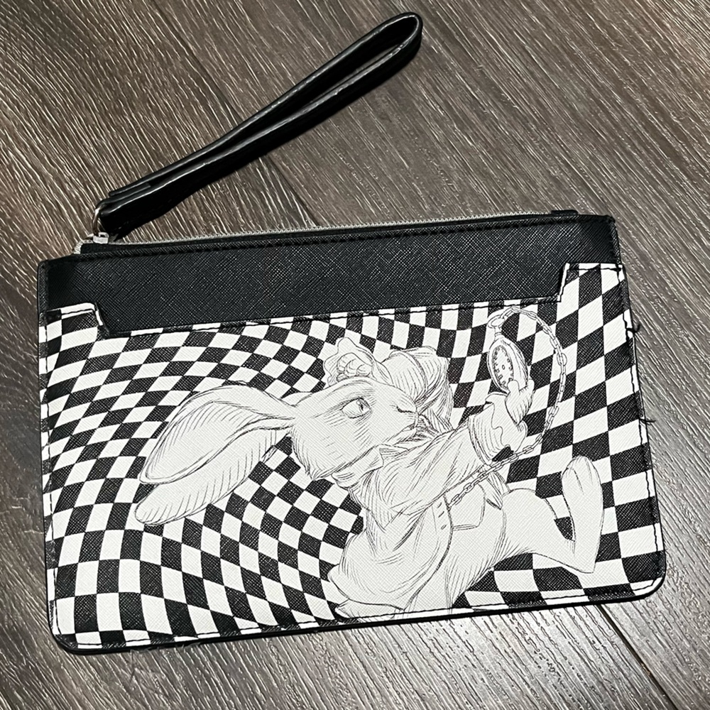 Disney Alice looking through the glass 
Black and White Wristlet Clutch